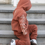*Pre-order* Kaitiaki Tamariki Tracksuit - Rust